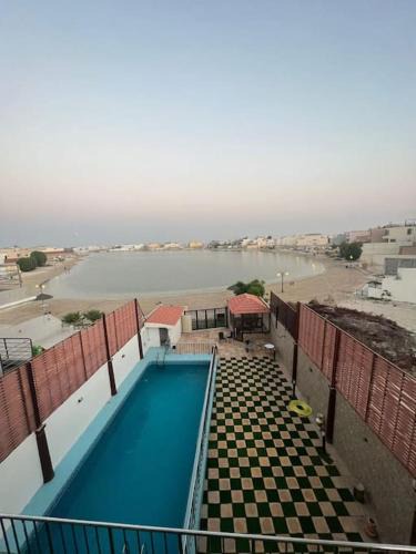 Dhahran Ski Chalet | شاليه موج البحري بمسبح وشاطئ خاص