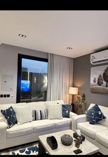 Al Hofuf Apartment | A cozy two-bedroom apartment with a living room and a patio that inspires relaxation