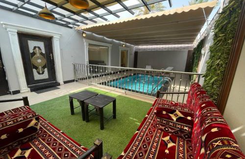 Al Aqiq Ski Chalet | شاليه وحديقة التوت بمسبح