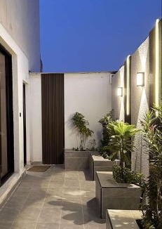 Al Hofuf Apartment | A cozy two-bedroom apartment with a living room and a patio that inspires relaxation