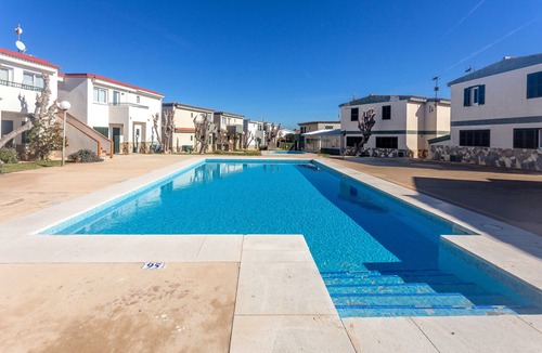 Los Delfines Apartment | Apartment 'Cala En Forcat' with Shared Pool, Private Terrace and Wi-Fi