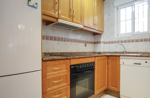 La Marina House | This beautiful vacation townhouse in La Marina on the Costa Blanca offers access to a communal pool