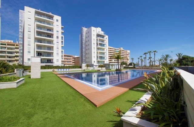 Modern ground floor apartment with 80m² terrace + parking at La Mata beach