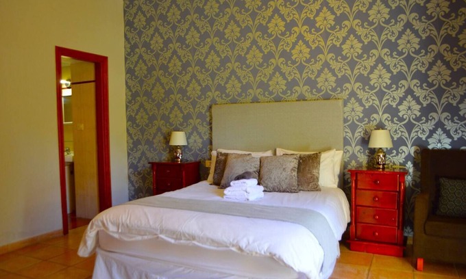 Vilaflor Apartment | Spacious Family room that can accommodate up to 2 adults and 1 child. En-suite bathroom with shower. There is a king size bed and a single bed if required. The room has views of the village square.